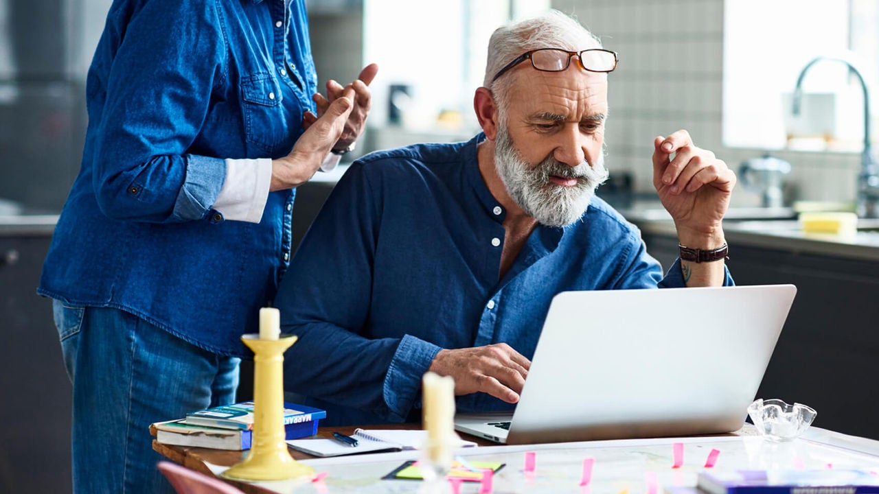 man looking at laptop
