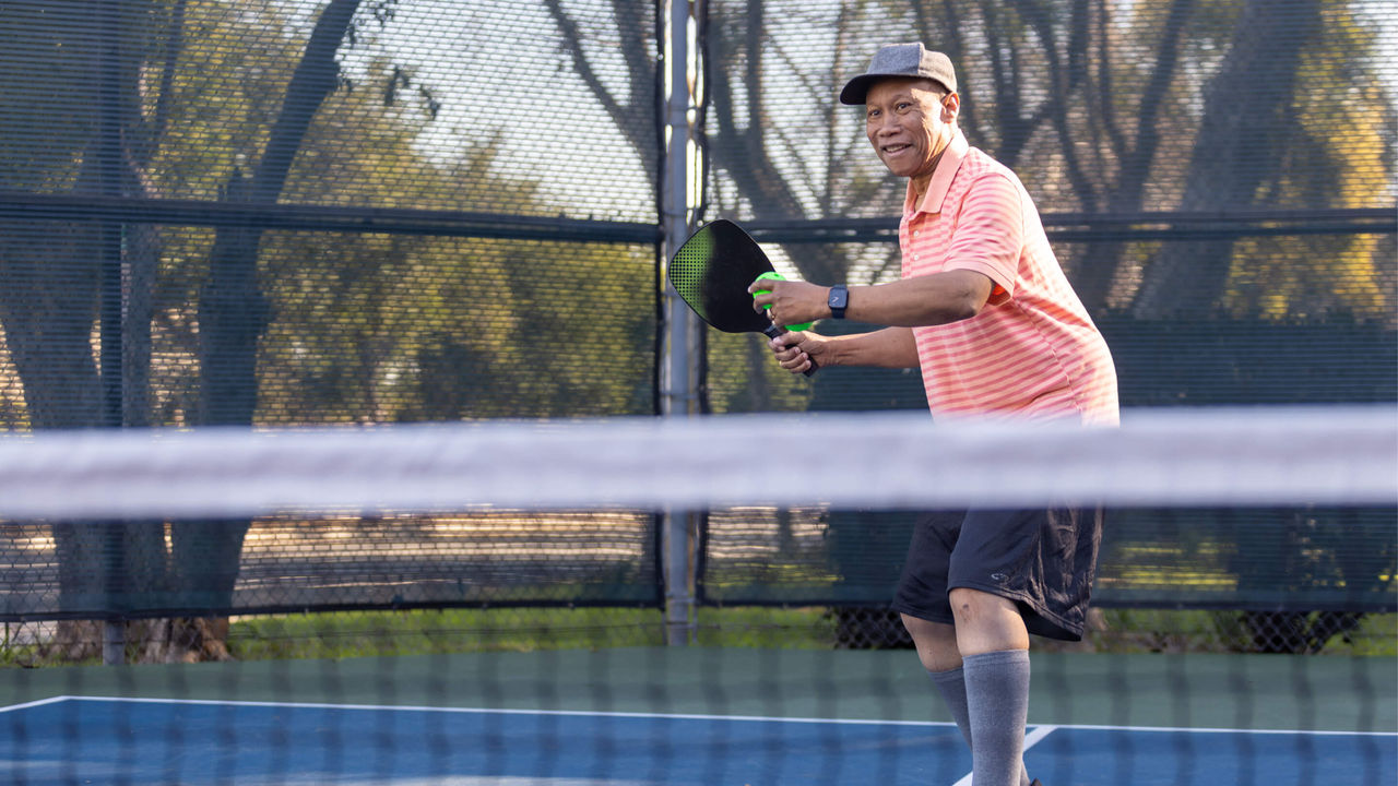 Man playing pickleball.