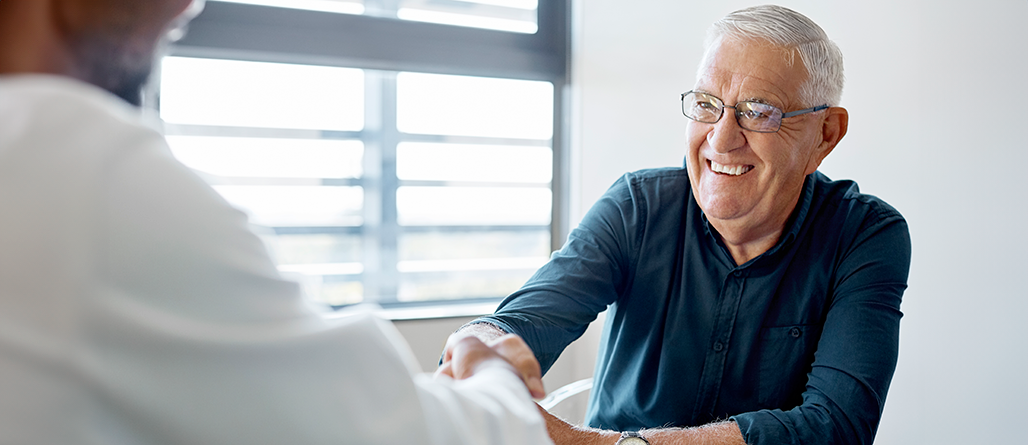 man smiling with doctor
