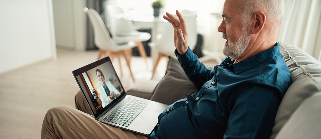 man on computer with doctor